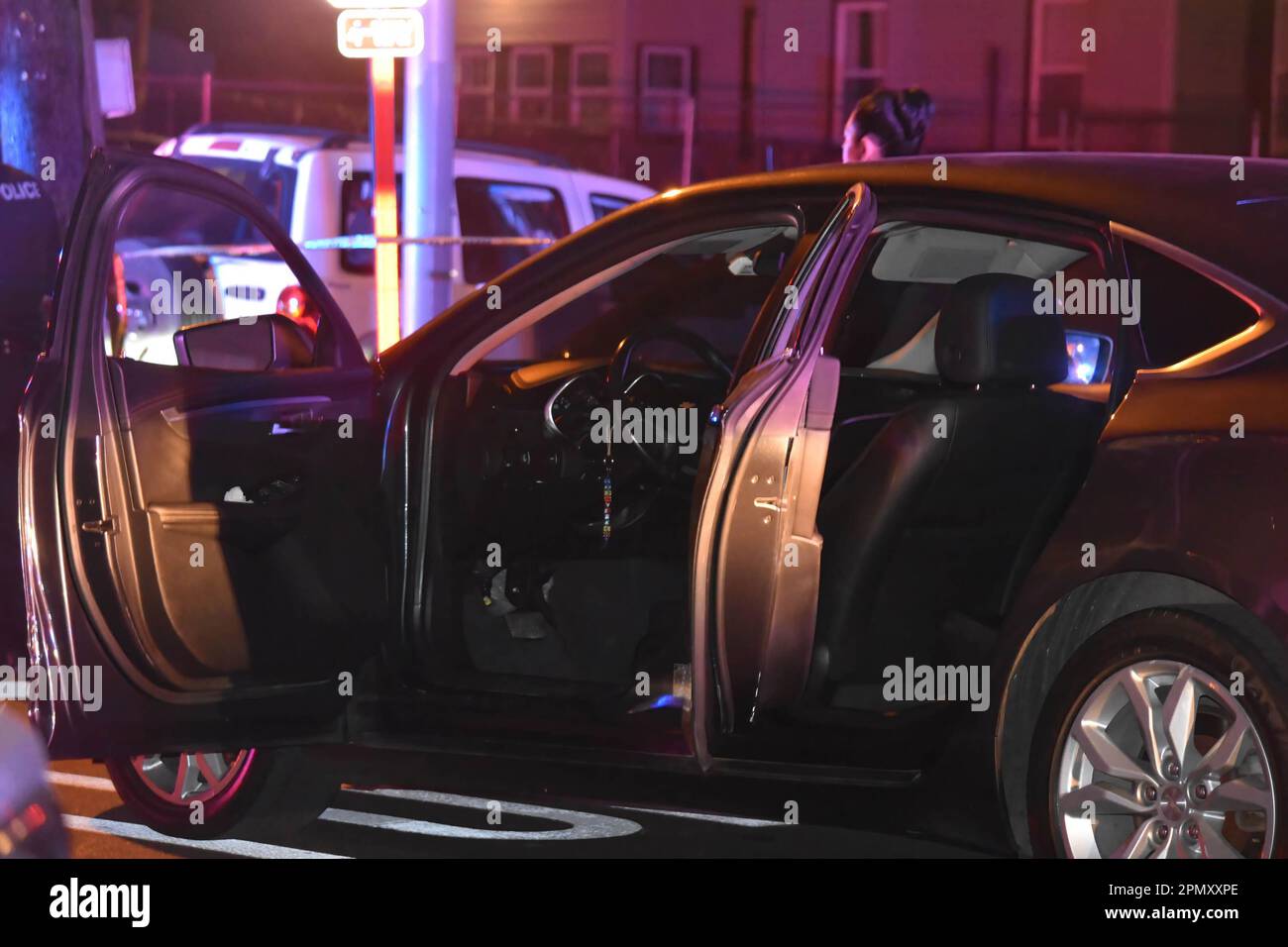 Paterson, USA. 15th Apr, 2023. Investigators gather near a vehicle in the area of East 22nd Street. Four people reported shot in a shooting in Paterson, New Jersey, United States in the early morning hours of Saturday, April 15, 2023. Reportedly, four people were shot early Saturday morning after 12:00 AM in Paterson, some of the victims were transported by EMS and some victims were transported by private vehicles. No further information was immediately available from the Paterson police department. There are several crime scenes. One crime scene in the area of East 22nd Street had a Stock Photo