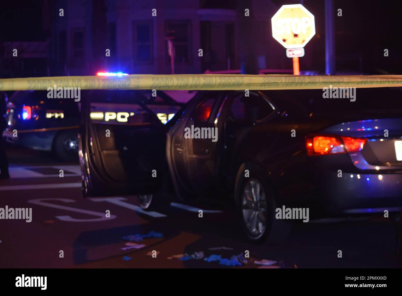 Paterson, USA. 15th Apr, 2023. Investigators gather near a vehicle in the area of East 22nd Street. Four people reported shot in a shooting in Paterson, New Jersey, United States in the early morning hours of Saturday, April 15, 2023. Reportedly, four people were shot early Saturday morning after 12:00 AM in Paterson, some of the victims were transported by EMS and some victims were transported by private vehicles. No further information was immediately available from the Paterson police department. There are several crime scenes. One crime scene in the area of East 22nd Street had a Stock Photo