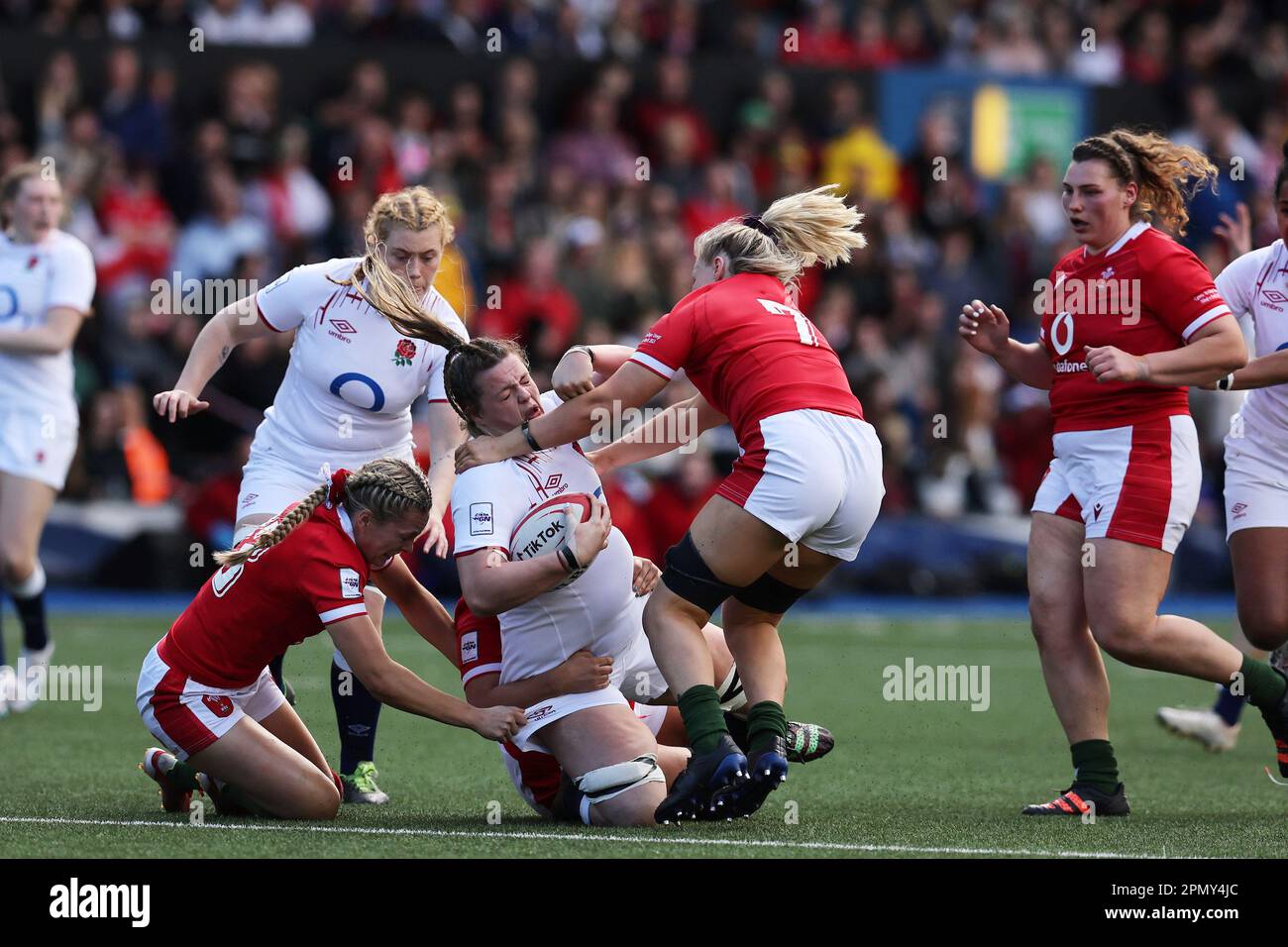 Cardiff, UK. 15th Apr, 2023. Sarah Beckett of England (c) is stopped by Hannah Jones (l) and Alex Callender of Wales (r). TikTok Women's Six Nations 2023 championship, Wales women v England women at Cardiff Arms Park in Cardiff, South Wales on Saturday 15th April 2023. pic by Andrew Orchard/Andrew Orchard sports photography/Alamy Live news Credit: Andrew Orchard sports photography/Alamy Live News Stock Photo