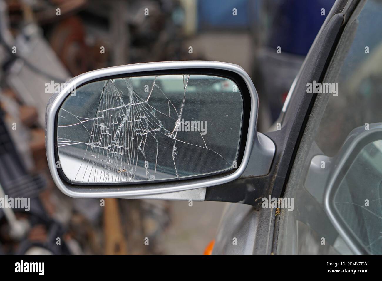 Cracked glass at car side mirror damage broken Stock Photo Alamy