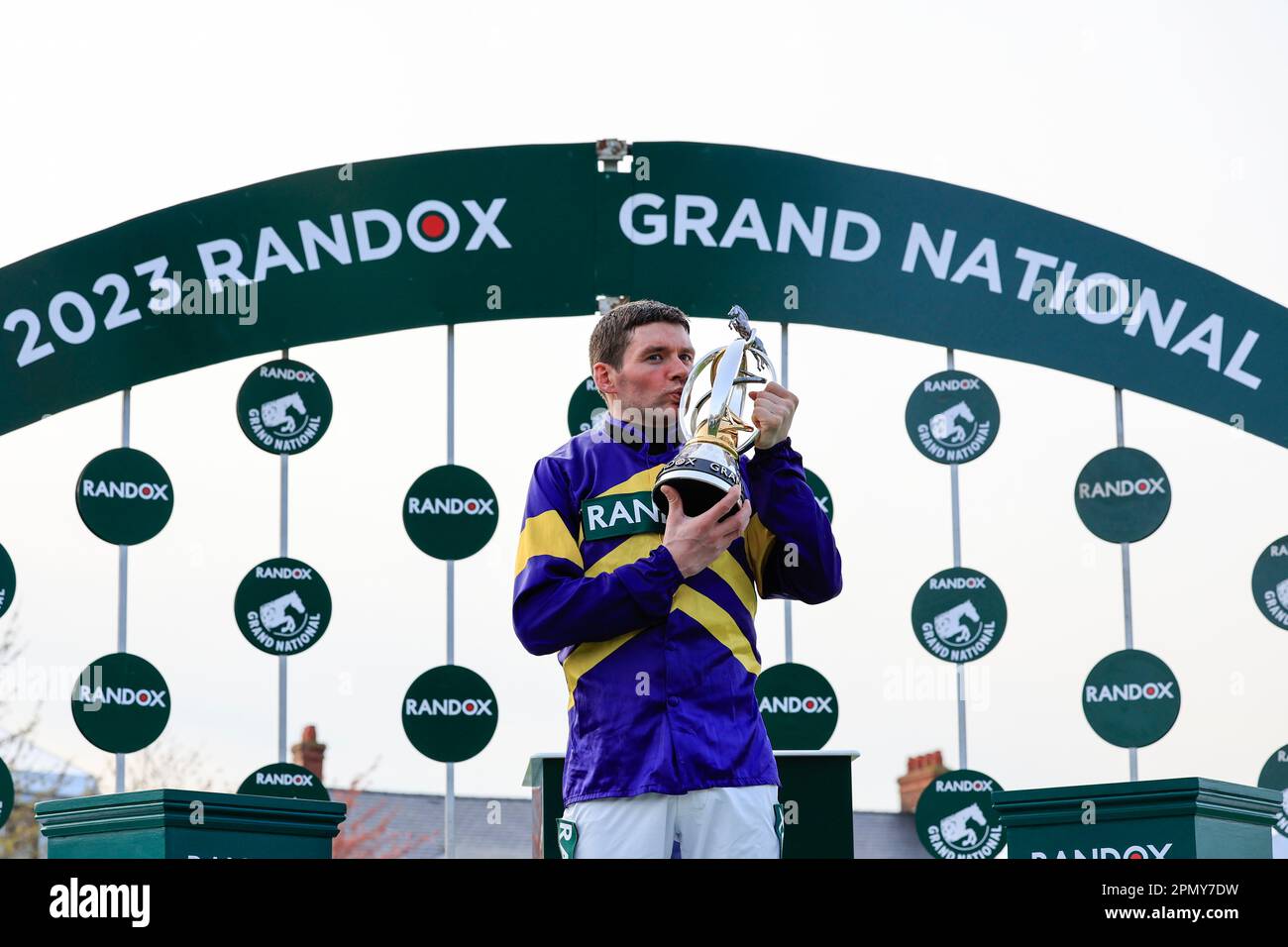 Derek Fox the Grand National winning jockey with the race trophy at The