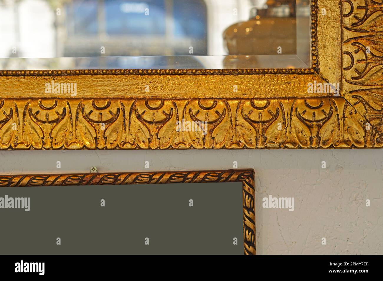 Detail shot of antique gold mirror frame at wall Stock Photo Alamy