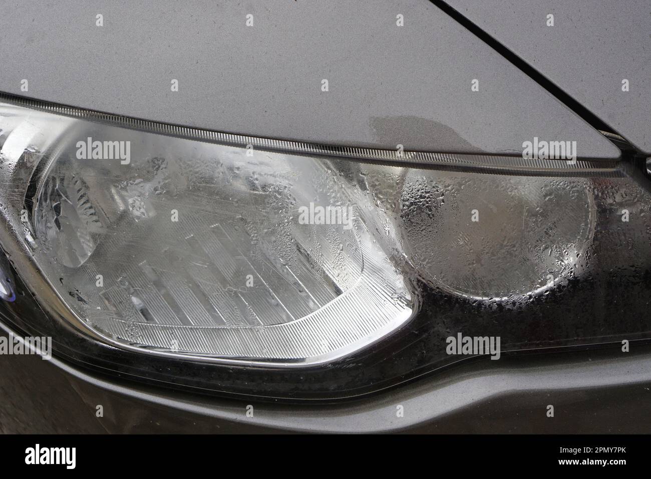 Condensed water in car front headlights lens damage problem Stock Photo