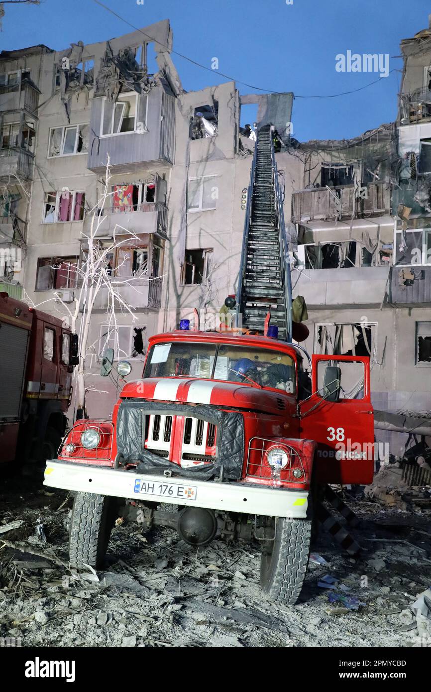 SLOVIANSK, UKRAINE - APRIL 14, 2023 - A fire engine is seen near a  residential building destroyed in the shelling of Russian troops,  Sloviansk, Donets Stock Photo - Alamy
