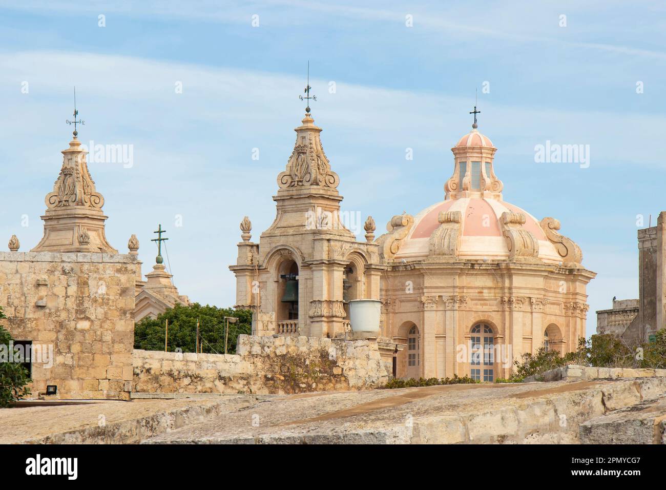 Mdina, Malta - November 13, 2022: The dome and belfries of St Paul's cathedral viewed  from outside the city walls Stock Photo