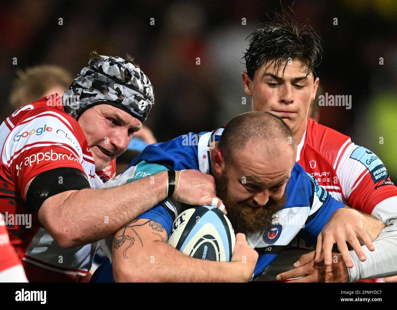 Kingsholm Stadium, Gloucester, Gloucestershire, UK. 14th Apr, 2023. Gallagher Premiership Rugby, Gloucester versus Bath; Louis Rees-Zammit and Ben Morgan of Gloucester tackle Tom Dunn of Bath Credit: Action Plus Sports/Alamy Live News Stock Photo