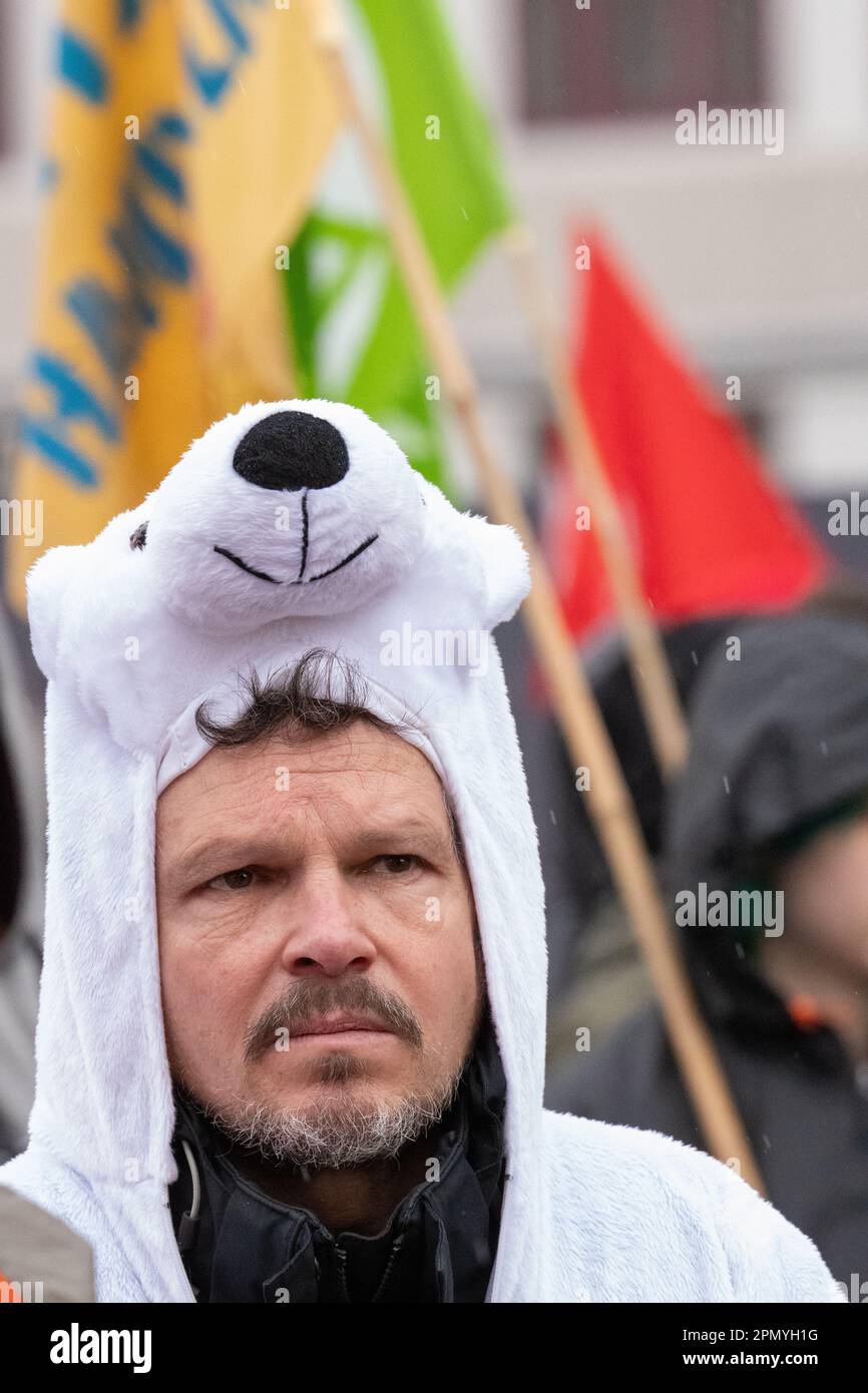 Man dressed as polar bear at Extinction Rebellion protest Berlin 15 April 2023. Protesters, including members of Extinction Rebellion, marched from the Bayer AG Pharmaceuticals centre ( North East central Berlin) to the Federal Ministry of Food and Agriculture in central Berlin. Outside the Ministry a 'die in', of  protesters dressed as animals, took place and saw the arrival of the 'Red Rebel Brigade' from Extinction Rebellion. Berlin Germany. Picture credit garyroberts/worldwidefeatures.com April 2023. Protesters, including members of Extinction Rebellion, marched from the Bayer AG Pharmaceu Stock Photo