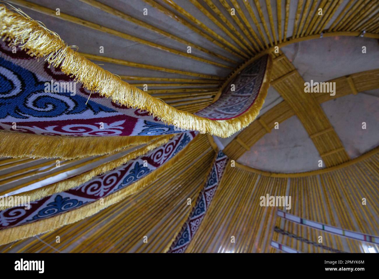 Kazakh yurt interior. Shanyrak, a round hole in the dome of the yurt is a symbol of the house. Stock Photo