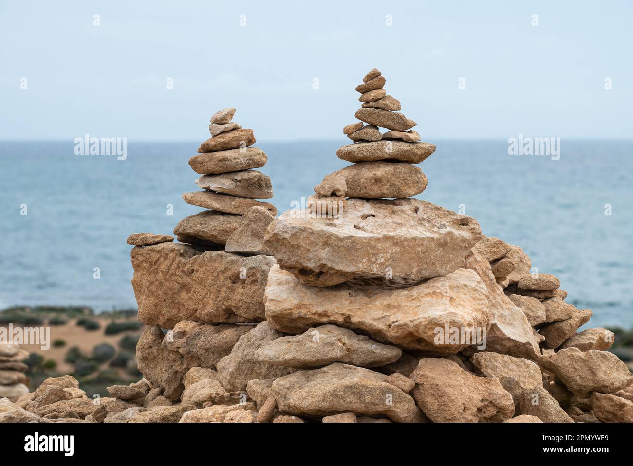Stacked brown pebble stones at the beach of Paphos, Cyprus Stock Photo