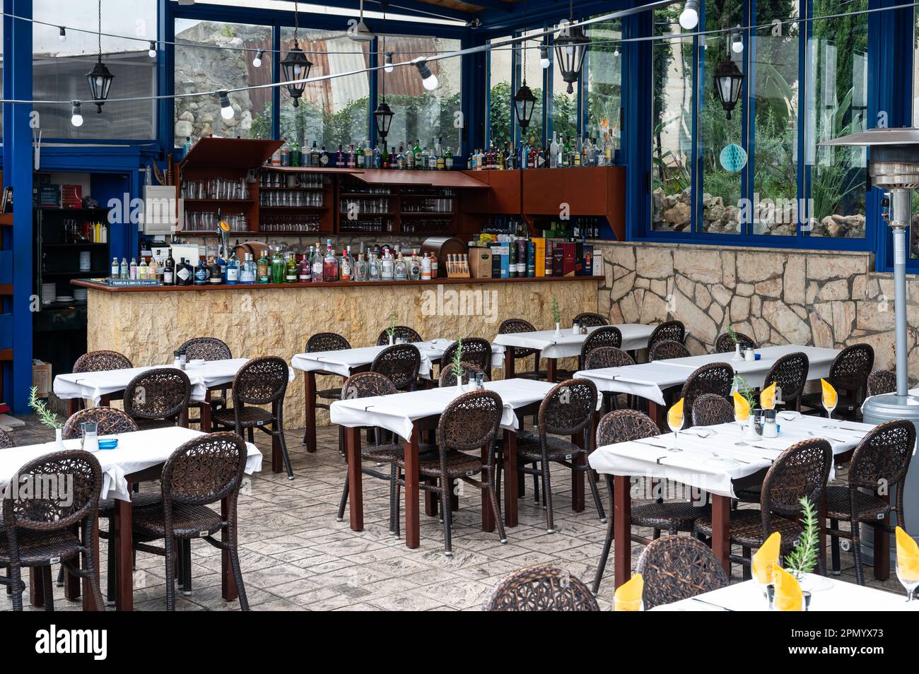 Polis Chrisochous, Cyprus, March 22, 2023 - Terrace of a typical Greek style restaurant Stock Photo