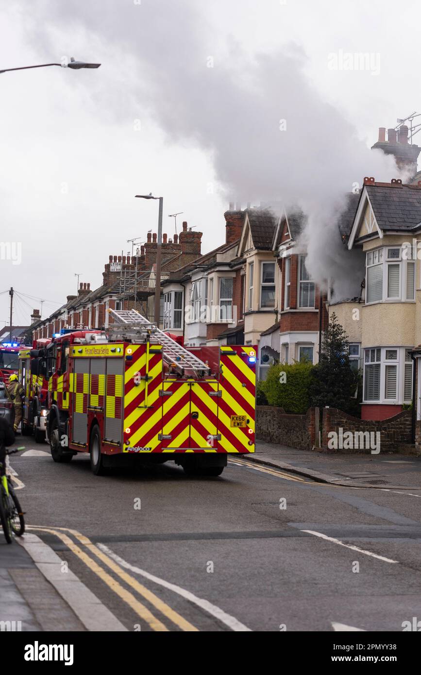 Essex County Fire & Rescue Service responding to a house fire in Westcliff on Sea, Essex, UK. Fire engine outside property with smoke billowing Stock Photo