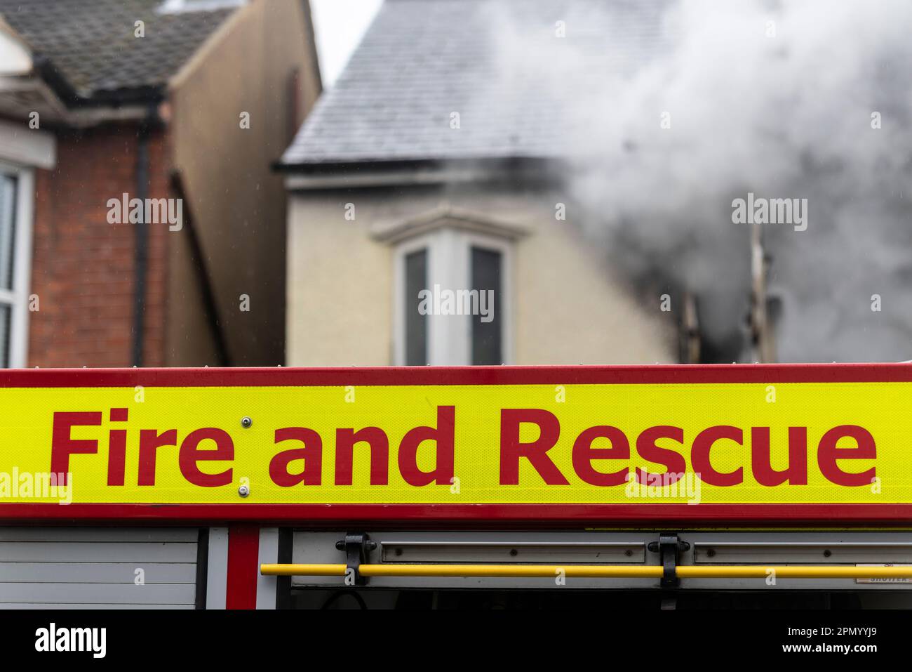 Essex County Fire & Rescue Service responding to a house fire in Westcliff on Sea, Essex, UK. Smoke from property. Fire and Rescue titles Stock Photo