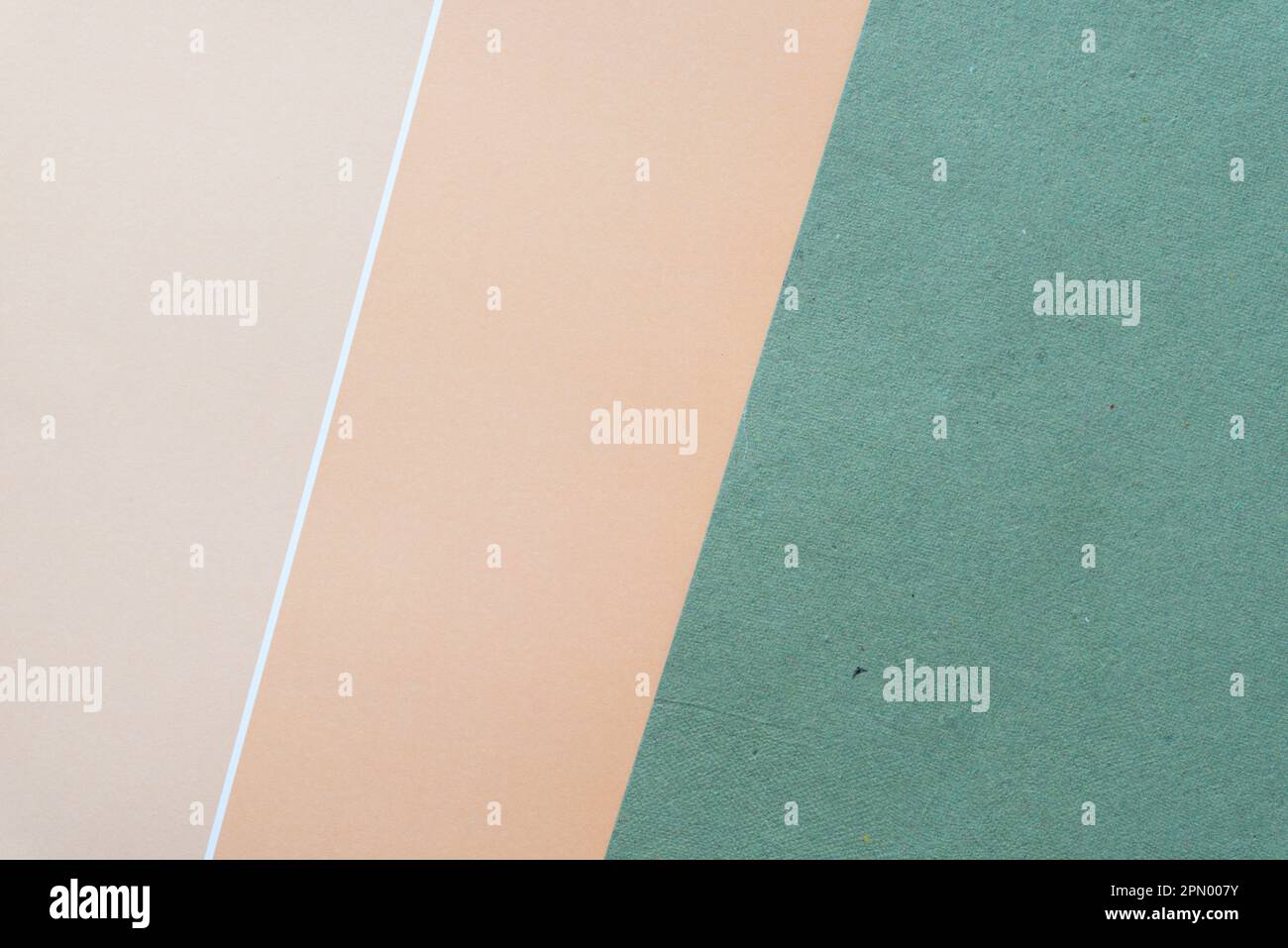 paper background with diagonal line in tan or beige and green Stock Photo