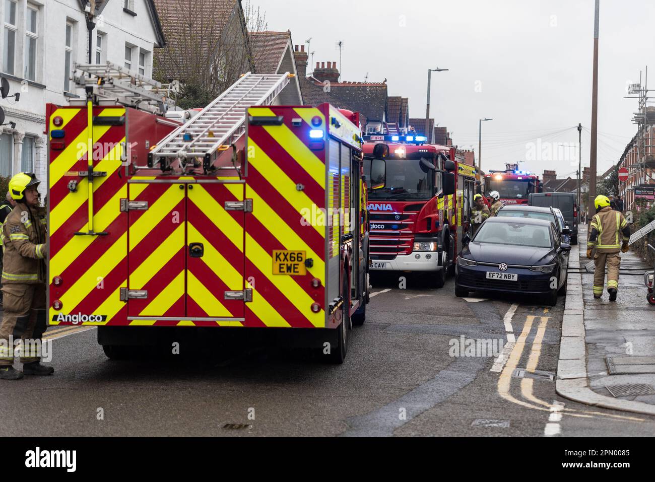 Essex County Fire & Rescue Service responding to a house fire in Westcliff on Sea, Essex, UK. Fire engines in street with firefighters Stock Photo
