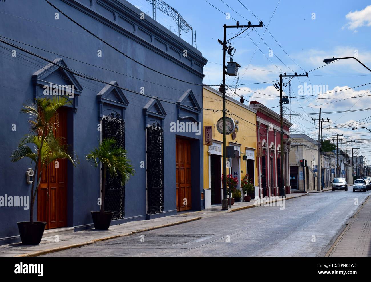 Colorful, colonial buildings on a street in the historic city of Merida, Yucatan, Mexico. Stock Photo