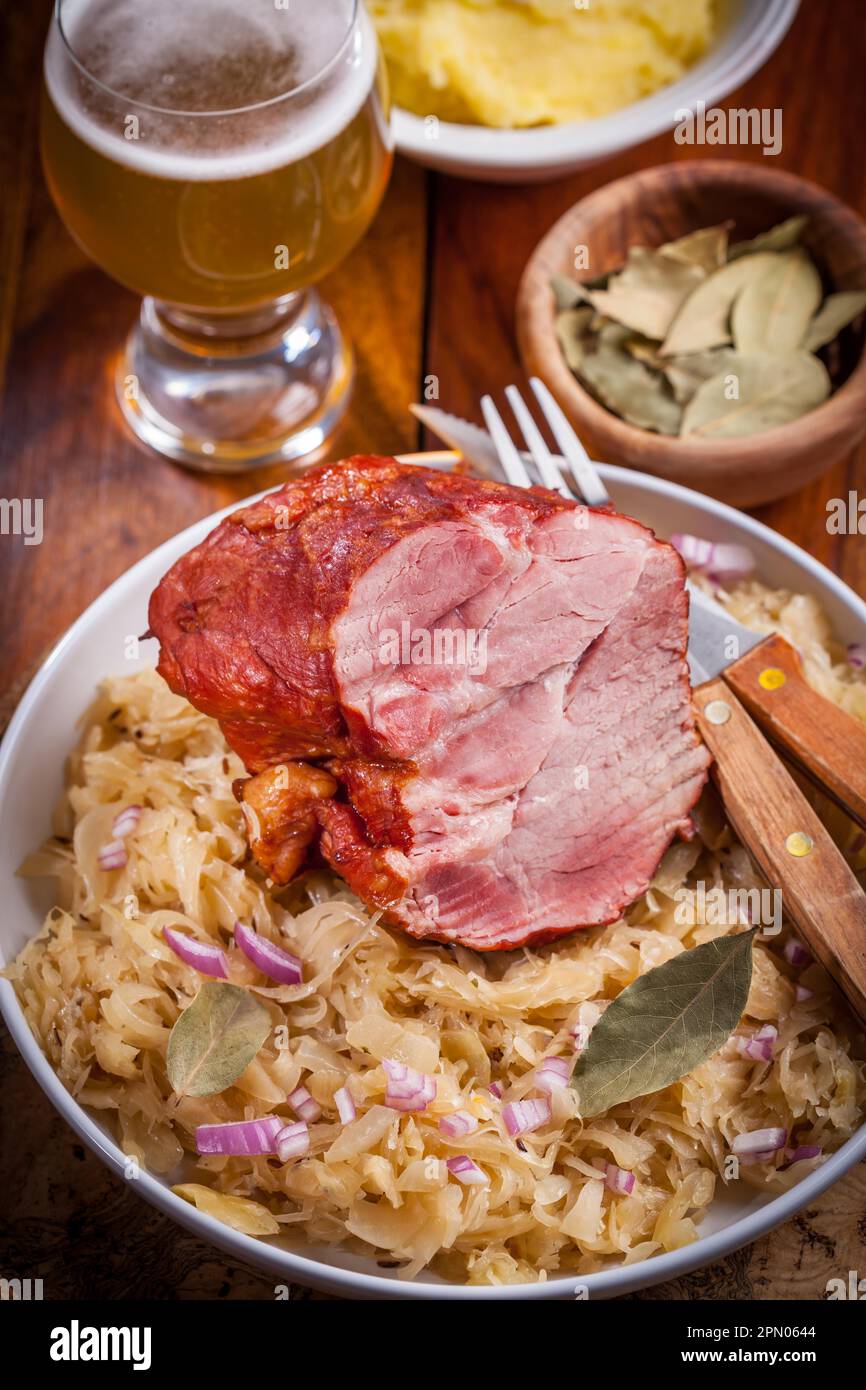 Smoked pork with cabbage (Sauerkraut) and beer Stock Photo Alamy