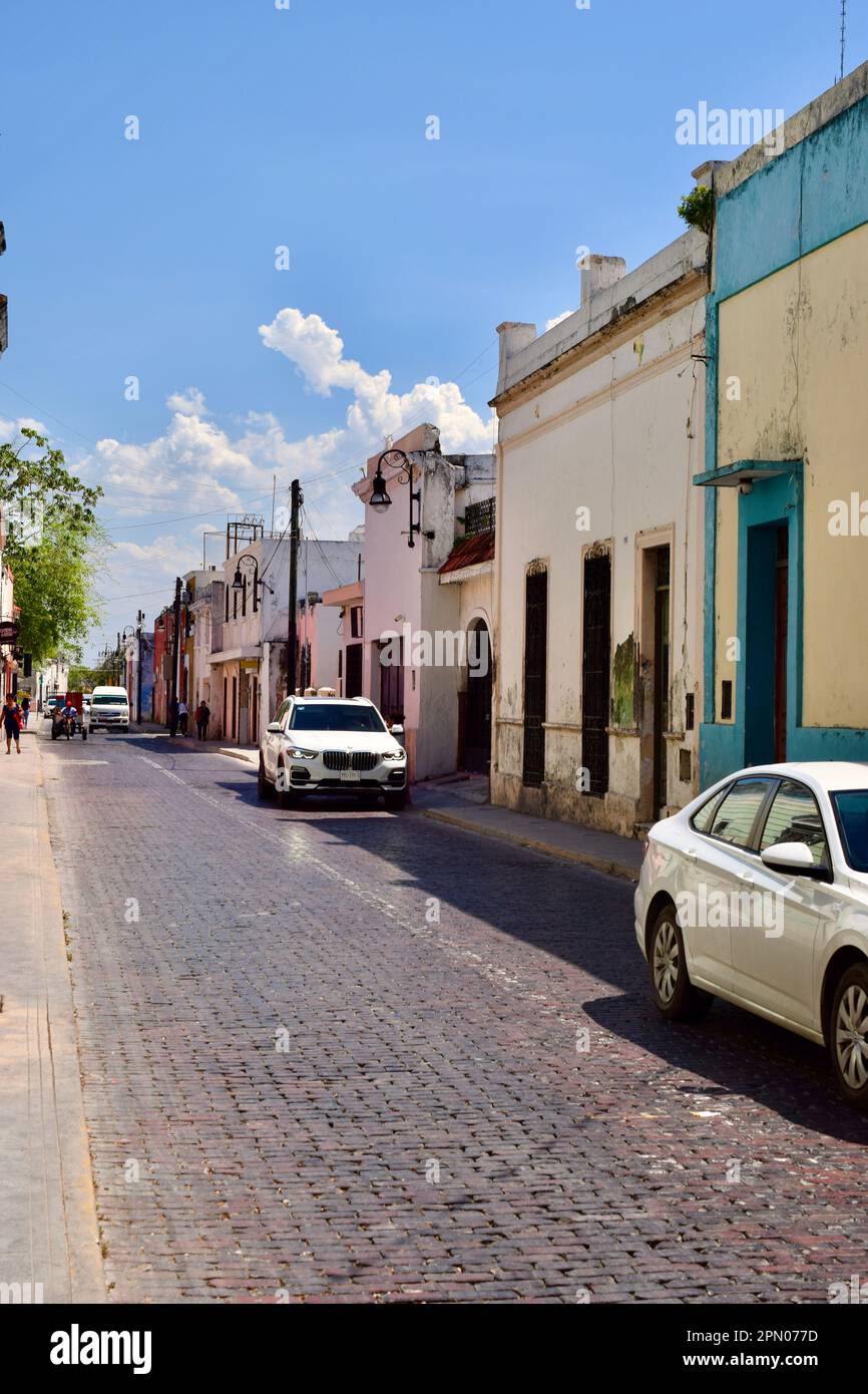 A street in Merida, Yucatan, Mexico, with cars and pedestrians Stock