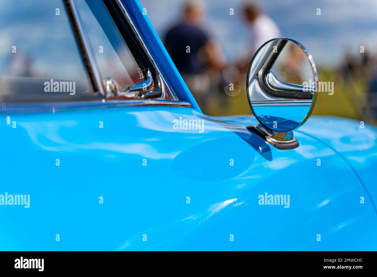 Blue oldtimer car round rearview mirror Stock Photo