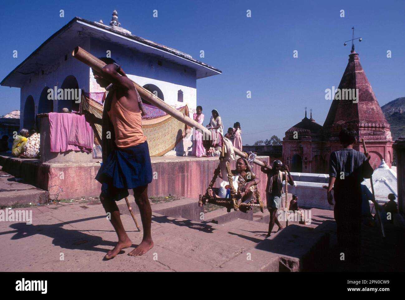 Dolly carriers, temple adjacent to hot water springs in Rajgir, Bihar, India, Asia Stock Photo