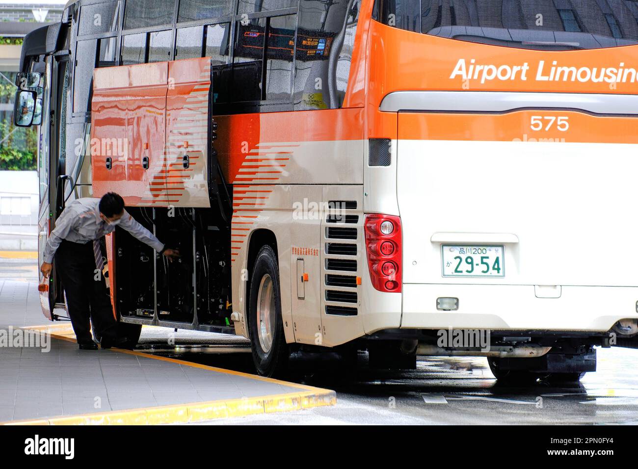 A highspeed bus staff member seen working at Busta Shinjuku, located