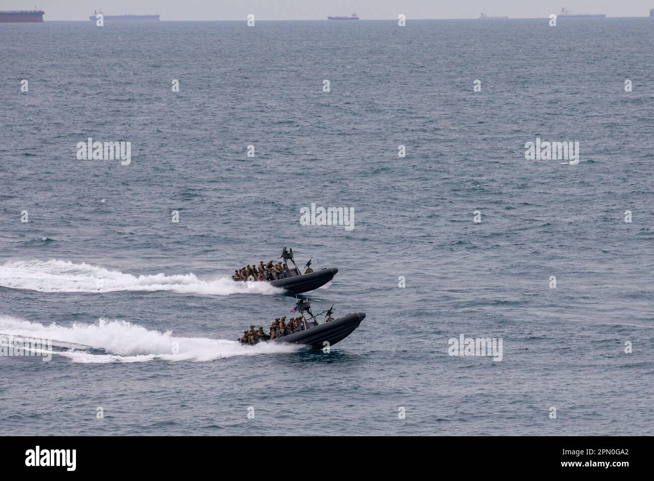 SOUTH CHINA SEA (Jan. 7, 2023) – U.S. Marines, with Maritime Raid Force, 13th Marine Expeditionary Unit, pilot their 11-meter rigid hull inflatable boats towards the objective during a maritime interdiction operation, Jan. 7. A force in readiness, the 13th MEU trains in maritime interdiction operations to rapidly respond to crisis across all domains. 7th Fleet is the U.S. Navy's largest forward-deployed numbered fleet, and routinely interacts and operates with Allies and partners in preserving a free and open Indo-Pacific region. (U.S. Marine Corps Photo by Sgt. Brendan Custer) Stock Photo