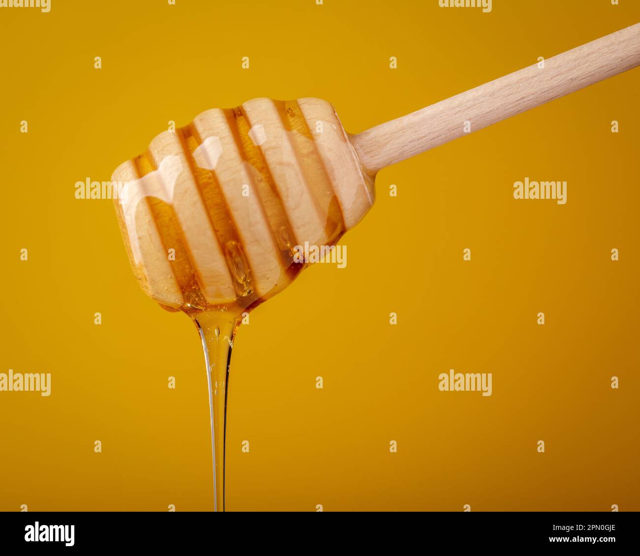 honey drip from dipper Stock Photo