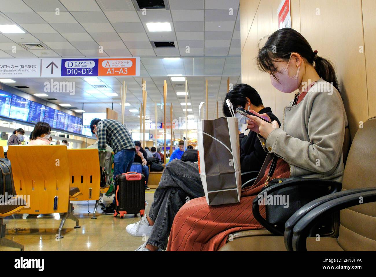 April 15, 2023, Tokyo, Japan A woman is seen waiting for highspeed and longdistance buses at