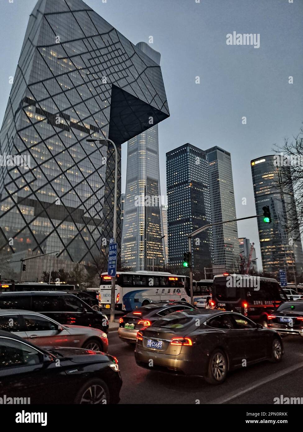 Traffic jam in after-work rush hour among CCTV Tower and commercial buildings in Central Business District in the evening, Beijing, China. Stock Photo