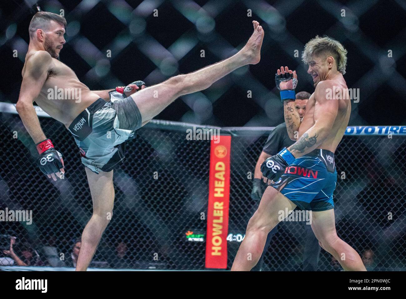 Kansas City, MO, Missouri, USA. 15th Apr, 2023. KANSAS Kansas City, MO, MISSOURI - APRIL 15: (L-R) Bill Algeo kicks TJ Brown in a featherweight bout during UFC Fight Night Kansas City - Holloway vs Allen at T-Mobile Center on April 15th, 2023 in Kansas City, Missouri, United States. (Credit Image: © Matt Davies/PX Imagens via ZUMA Press Wire) EDITORIAL USAGE ONLY! Not for Commercial USAGE! Credit: ZUMA Press, Inc./Alamy Live News Stock Photo