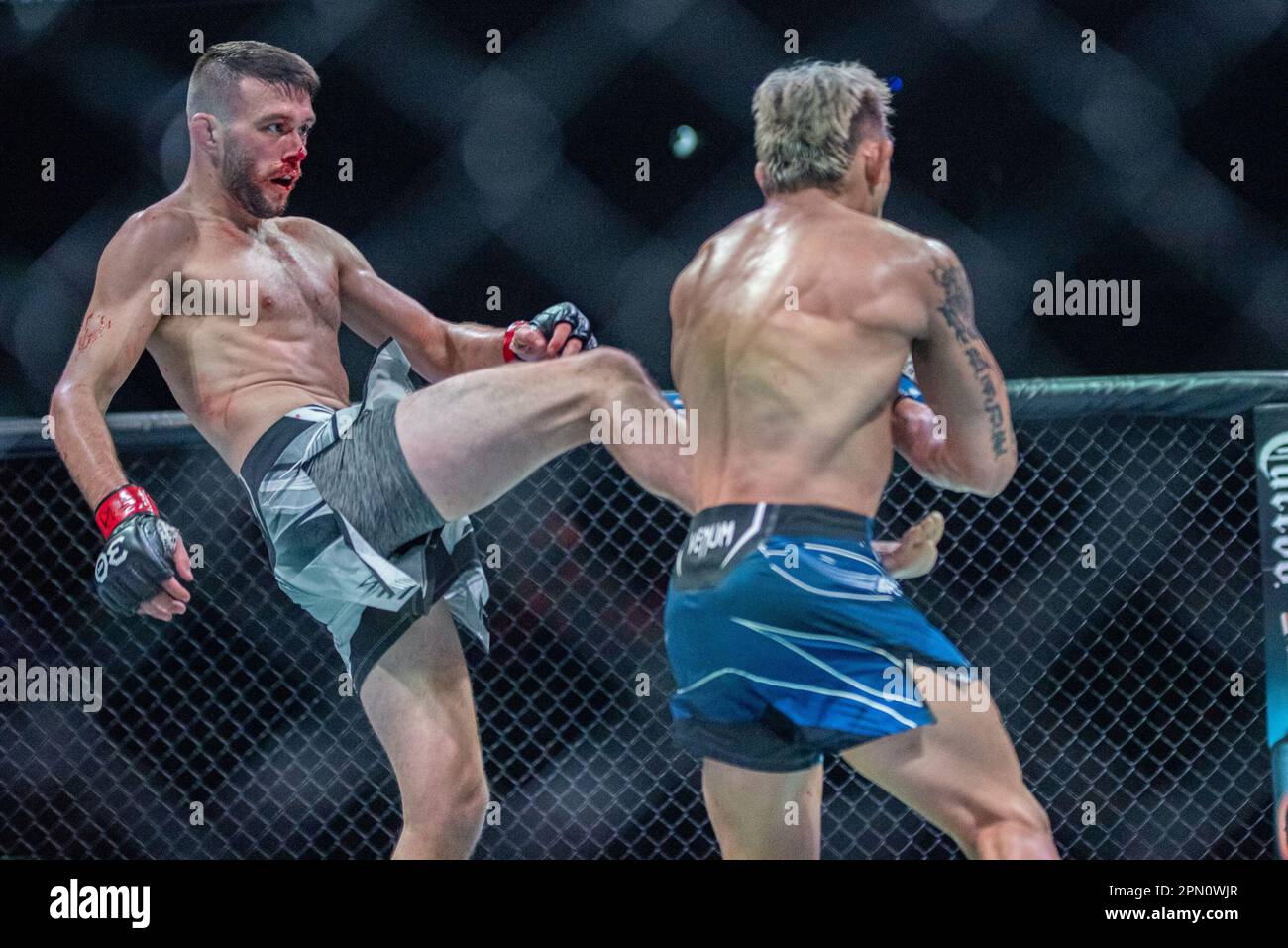 Kansas City, MO, Missouri, USA. 15th Apr, 2023. KANSAS Kansas City, MO, MISSOURI - APRIL 15: (L-R) Bill Algeo kicks TJ Brown in a featherweight bout during UFC Fight Night Kansas City - Holloway vs Allen at T-Mobile Center on April 15th, 2023 in Kansas City, Missouri, United States. (Credit Image: © Matt Davies/PX Imagens via ZUMA Press Wire) EDITORIAL USAGE ONLY! Not for Commercial USAGE! Credit: ZUMA Press, Inc./Alamy Live News Stock Photo