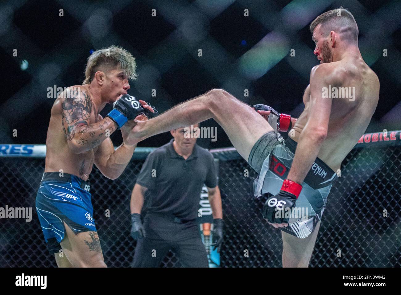 Kansas City, MO, Missouri, USA. 15th Apr, 2023. KANSAS Kansas City, MO, MISSOURI - APRIL 15: (R-L) Bill Algeo kicks TJ Brown in a featherweight bout during UFC Fight Night Kansas City - Holloway vs Allen at T-Mobile Center on April 15th, 2023 in Kansas City, Missouri, United States. (Credit Image: © Matt Davies/PX Imagens via ZUMA Press Wire) EDITORIAL USAGE ONLY! Not for Commercial USAGE! Credit: ZUMA Press, Inc./Alamy Live News Stock Photo