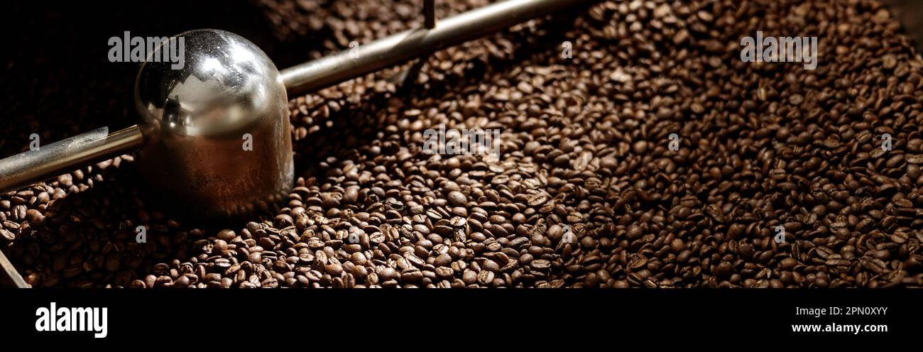 Cooling tray with brown roasted coffee beans Stock Photo - Alamy