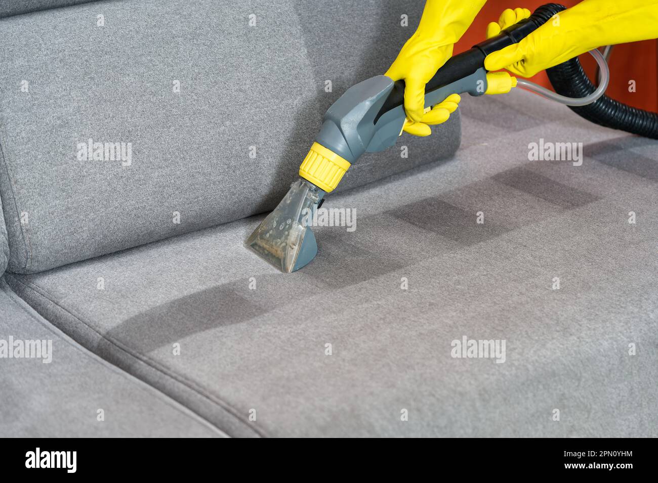 Sofa before and after wet cleaning indoors. textile sofa vacuum