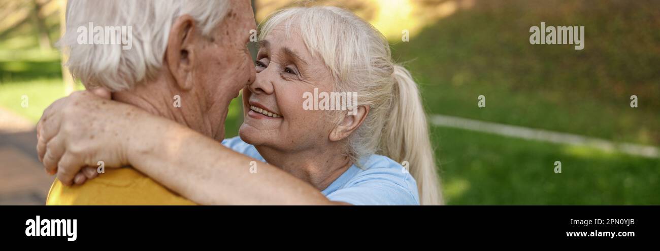 Cheerful mature woman green hi-res stock photography and images - Alamy