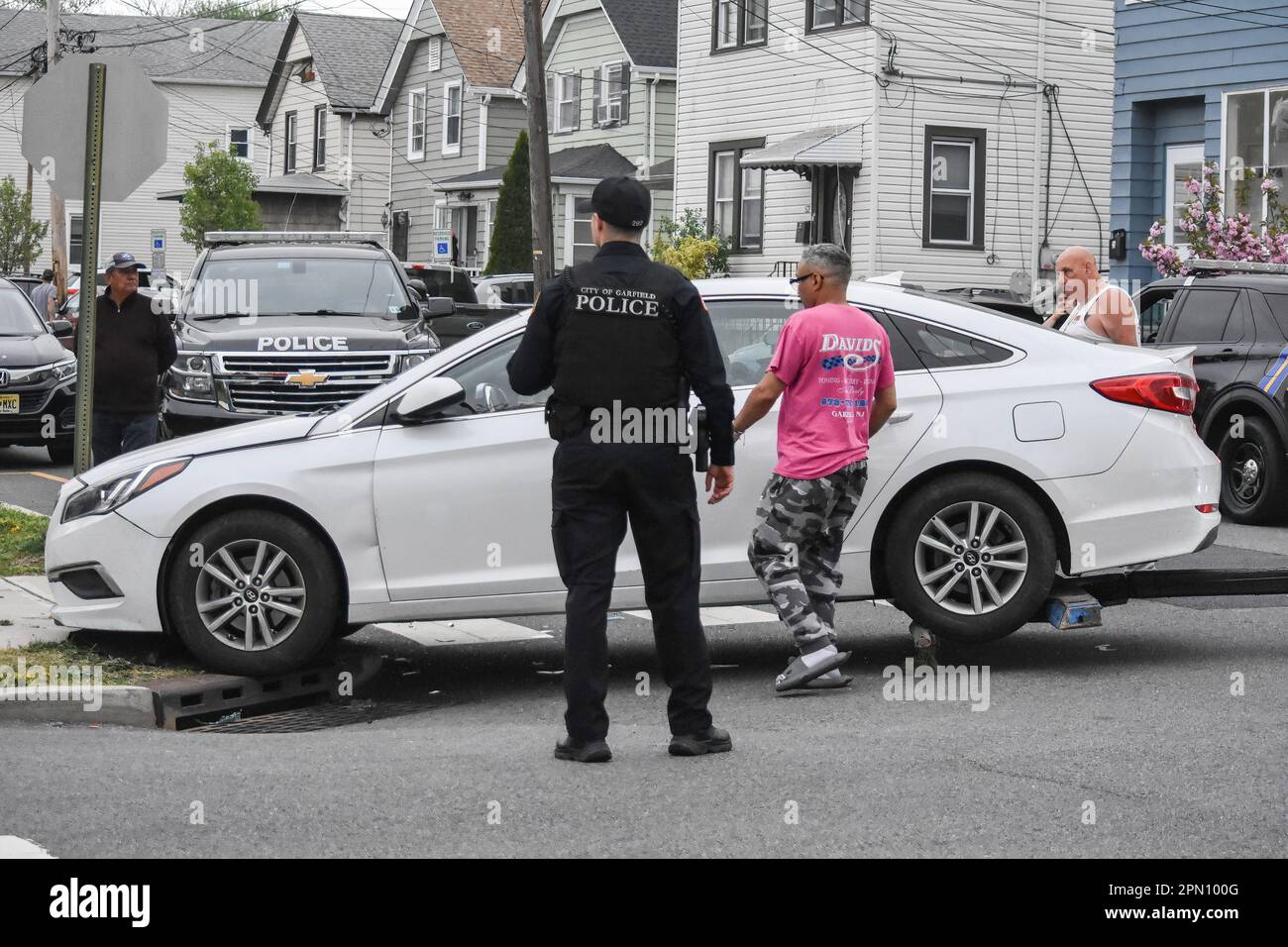 Garfield, United States. 15th Apr, 2023. Police officers overlook the