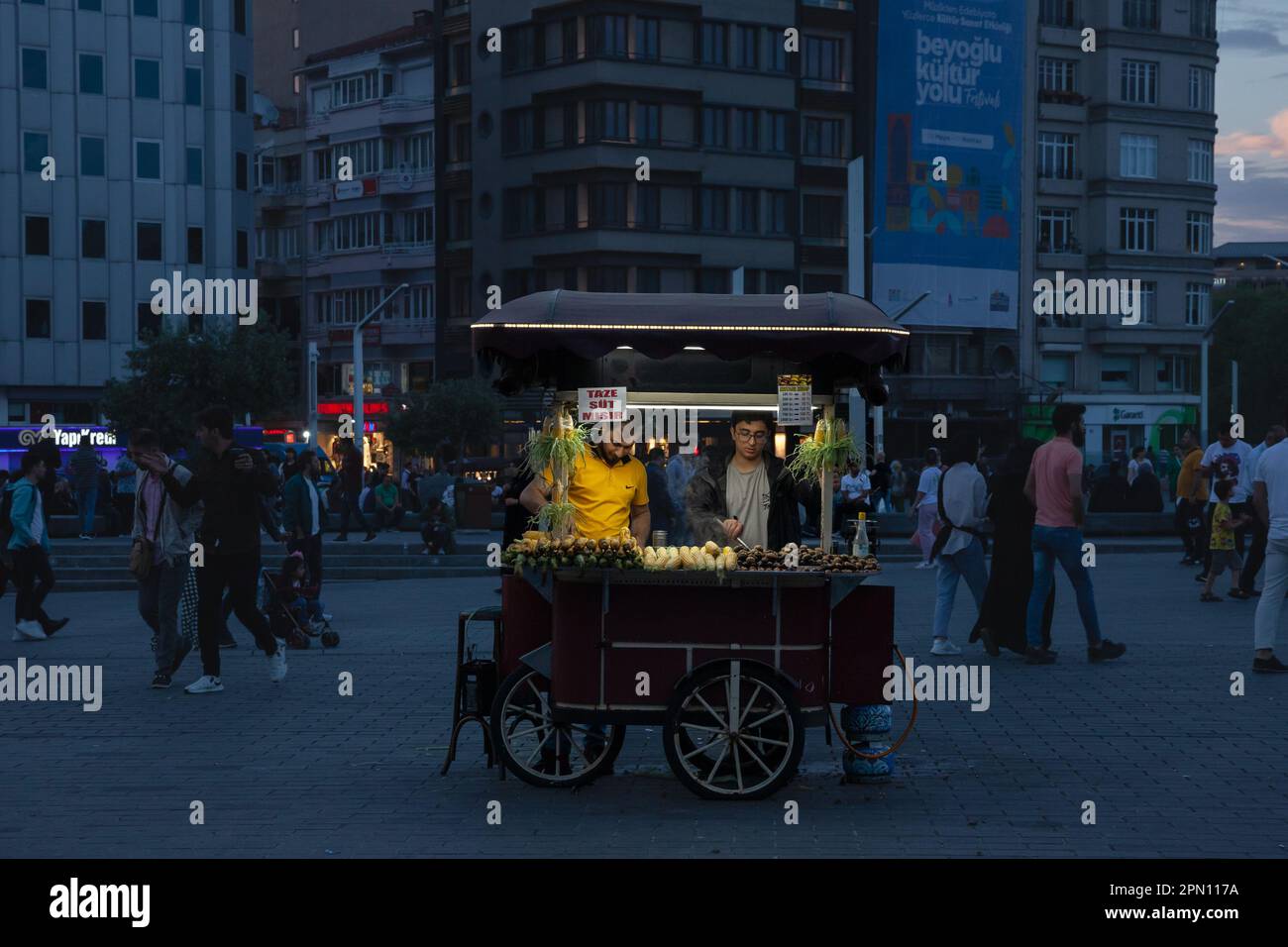 Picture of a chestnut and corn seller on the taksim square selling his street food on taksim square. Stock Photo