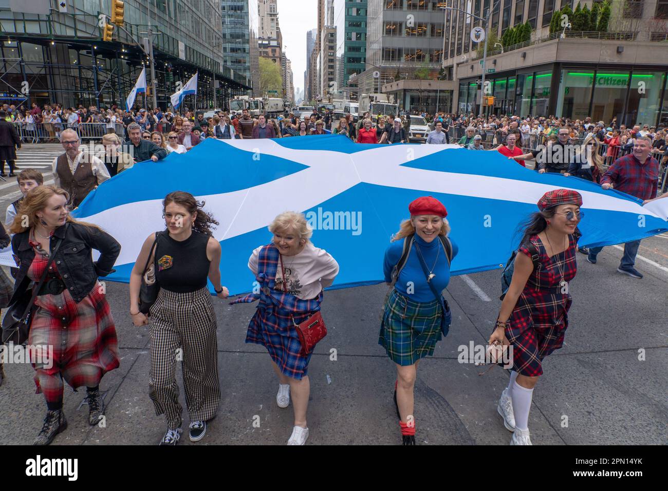 New York, New York, USA. 15th Apr, 2023. (NEW) 25th Annual New York City Tartan Day Parade. April 15, 2023, New York, New York, USA: Participants carrying a large Scottish flag march at the 25th Annual Tartan Day Parade in Manhattan on April 15, 2023 in New York City. (Credit Image: © M10s/TheNEWS2 via ZUMA Press Wire) EDITORIAL USAGE ONLY! Not for Commercial USAGE! Stock Photo