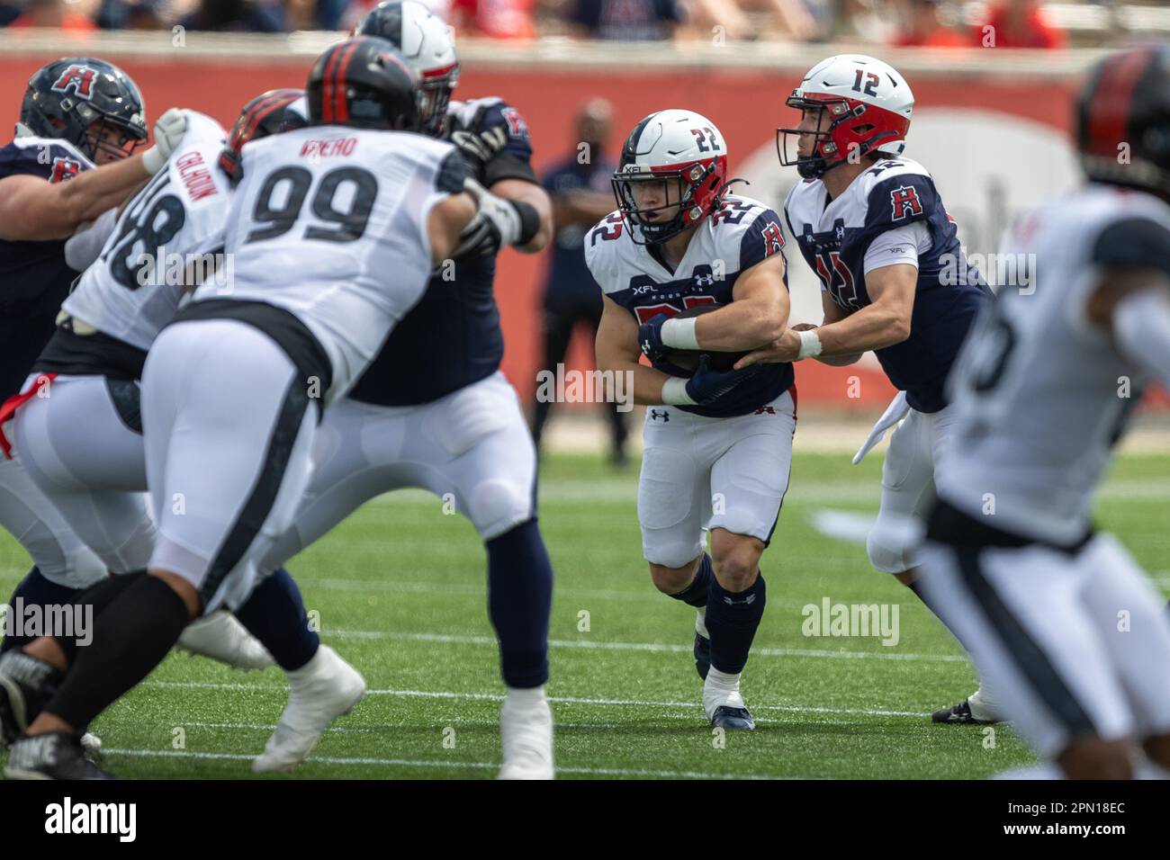 Houston Roughnecks running back Max Borghi (22) gets the ball from quarterback Brandon Silvers (12) against the Vegas Vipers, Saturday, April 15, 2023 Stock Photo