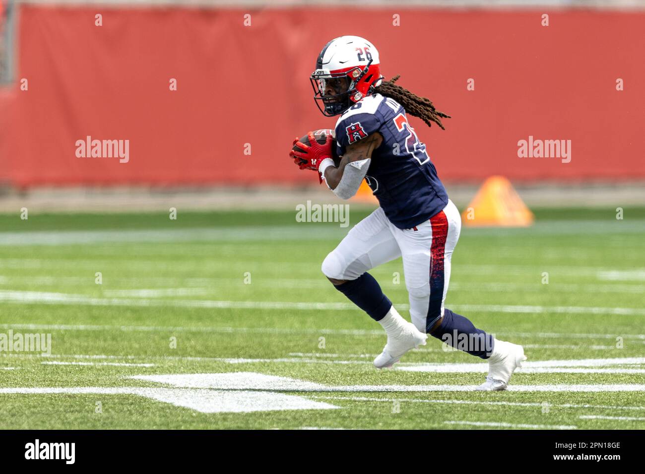 Houston Roughnecks running back Brycen Alleyne (26) looks for running room after making a catch against the Vegas Vipers defense, Saturday, April 15, Stock Photo