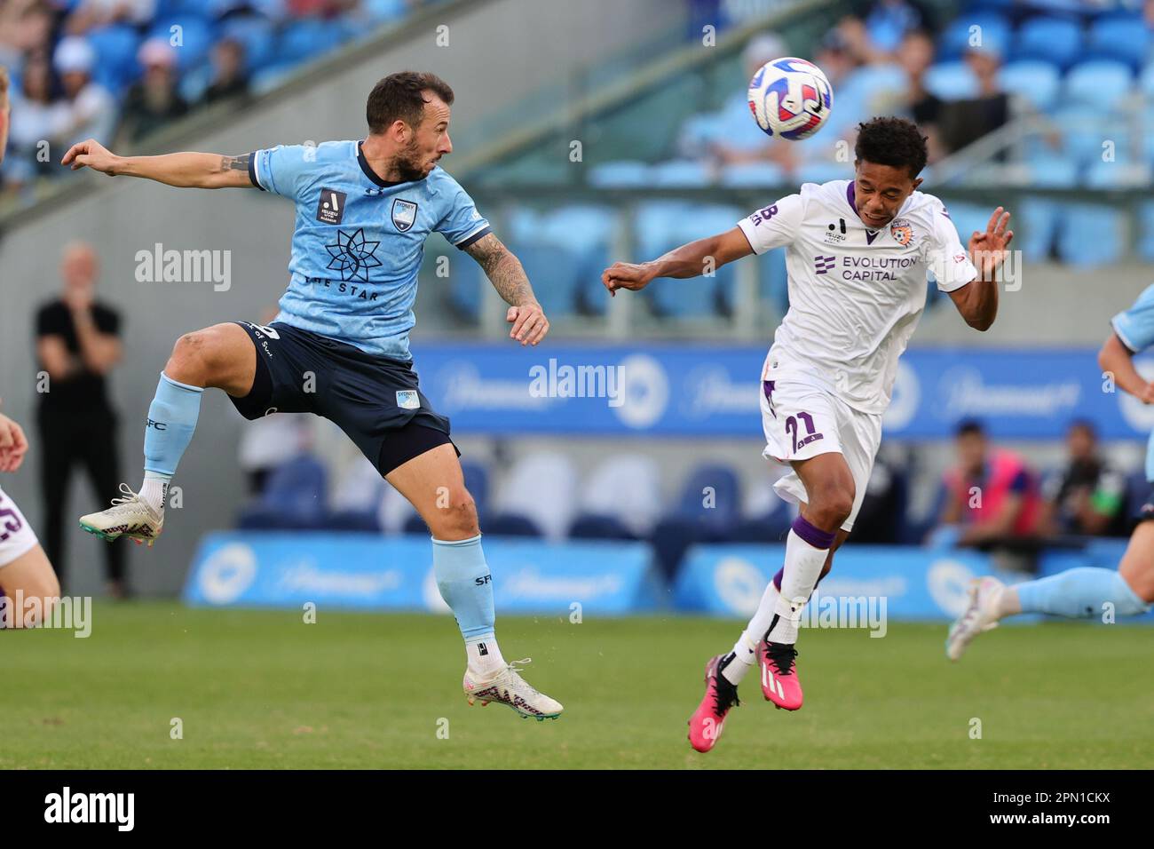 Sydney, Australia. 16th Apr, 2023. Adam Le Fondre of Sydney FC attempts a header defended by Antonee Burke-Gilroy of Perth Glory during the Australia A League match between Sydney FC and Perth Glory at Allianz Stadium, Sydney, Australia on 16 April 2023. Photo by Peter Dovgan. Editorial use only, license required for commercial use. No use in betting, games or a single club/league/player publications. Credit: UK Sports Pics Ltd/Alamy Live News Stock Photo