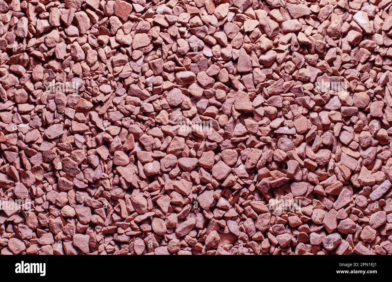 Pebbles sand pink coffee texture macro background Stock Photo