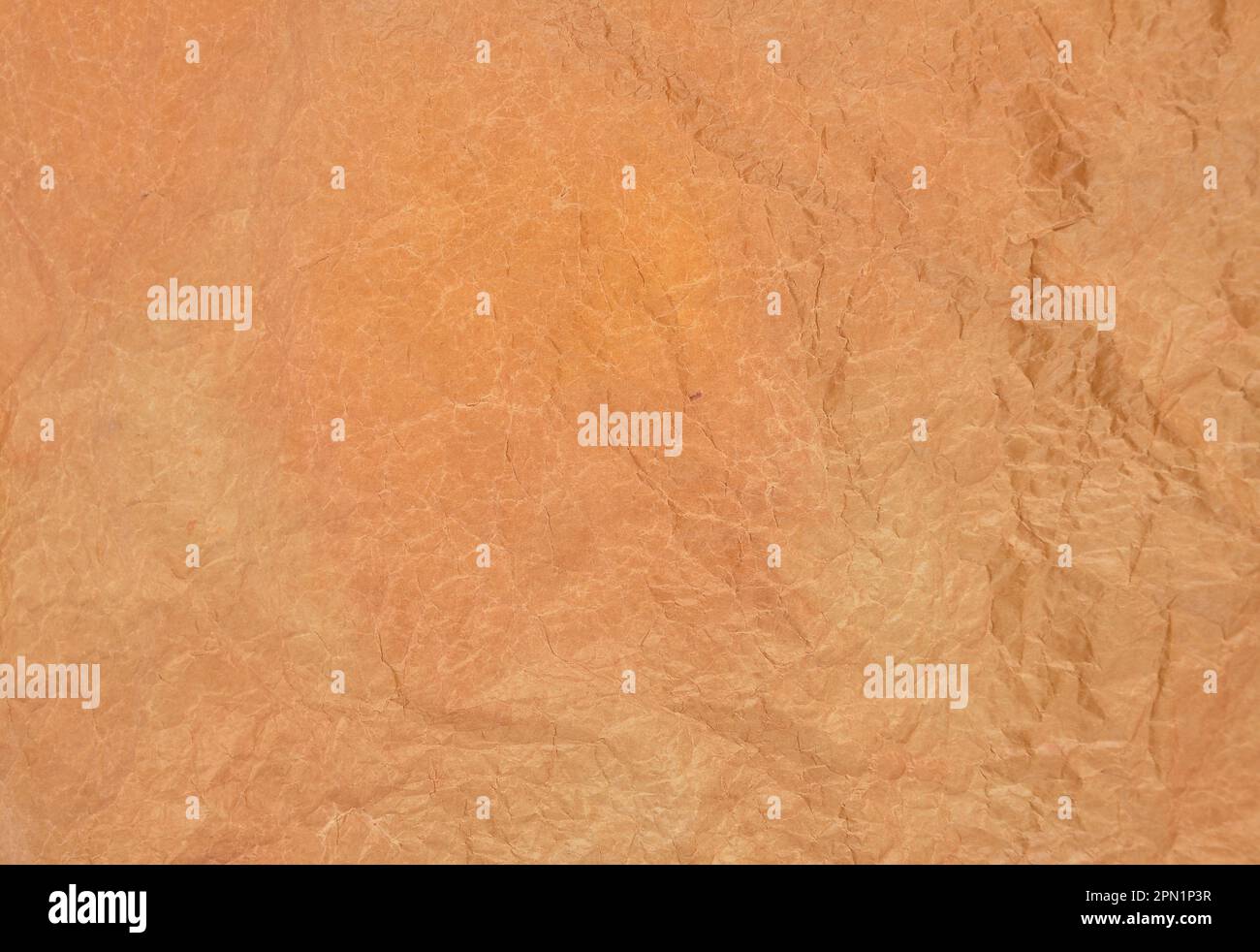 Brown crumpled baking paper as a background Stock Photo