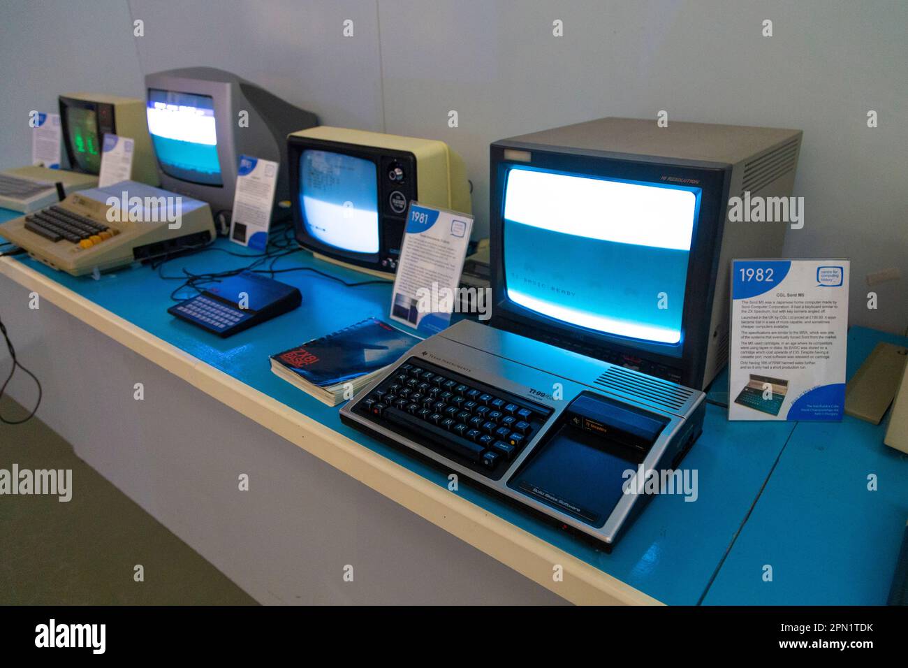 Display of 70s and 80s retro computers including Texas Instruments TI-99/4A at the Centre for Computing History, Cambridge, UK Stock Photo