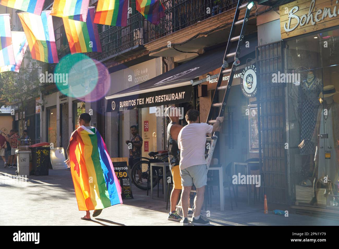 The employees of the stores of Chueca getting ready for the pride celebrations Stock Photo