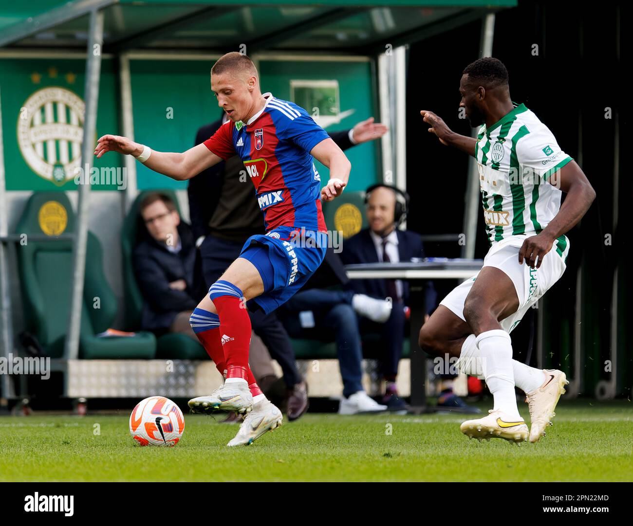 Palko Dardai of MOL Fehervar FC challenges Anderson Esiti of