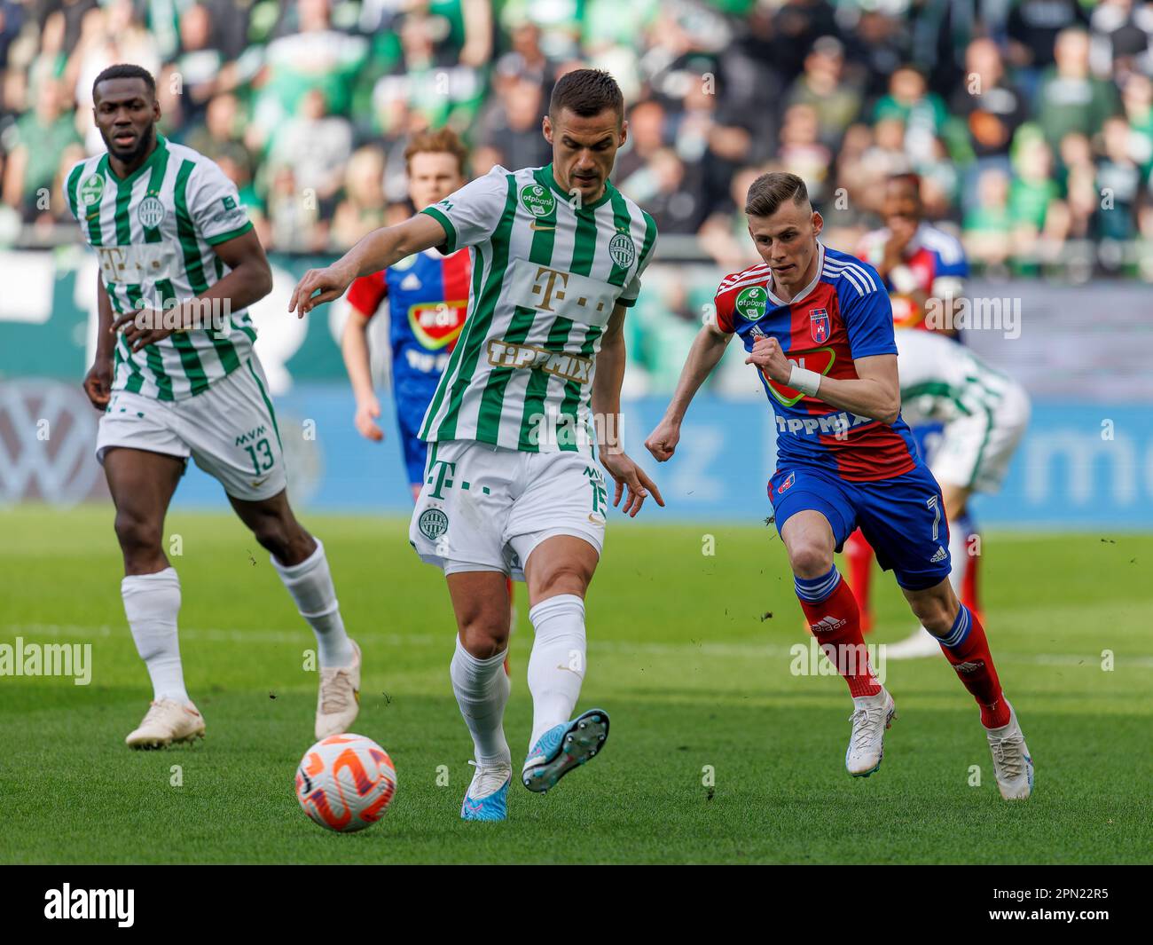 Palko Dardai of MOL Fehervar FC challenges Anderson Esiti of