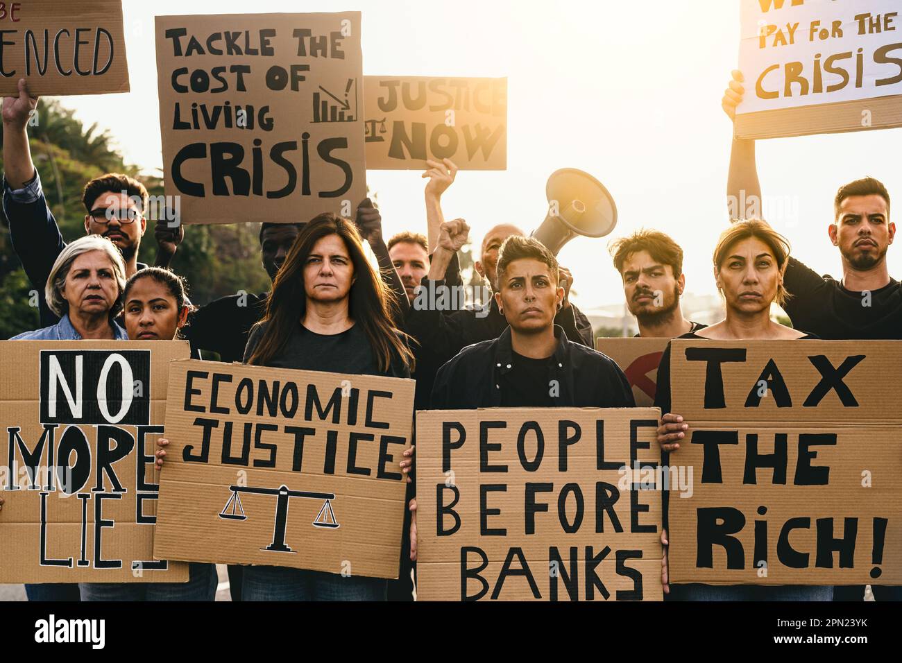 Demonstration of multiracial activists protesting against financial crisis and global inflation - Economic justice activism concept Stock Photo