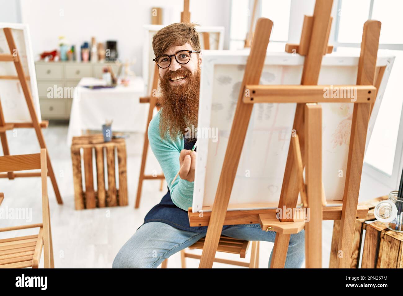 Smiling redhead man painting hi-res stock photography and images - Alamy