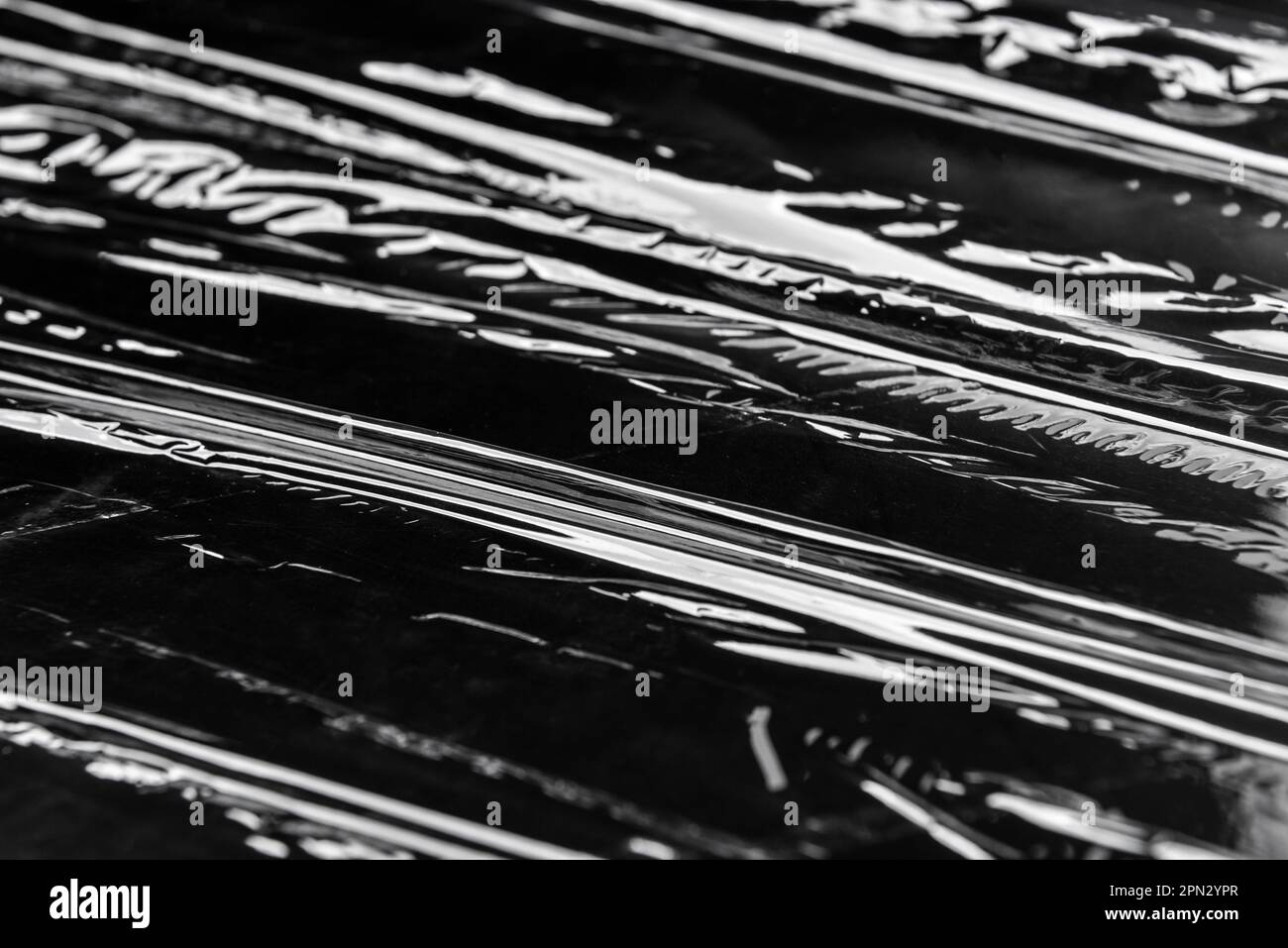 Plastic stretch wrap on black background Stock Photo