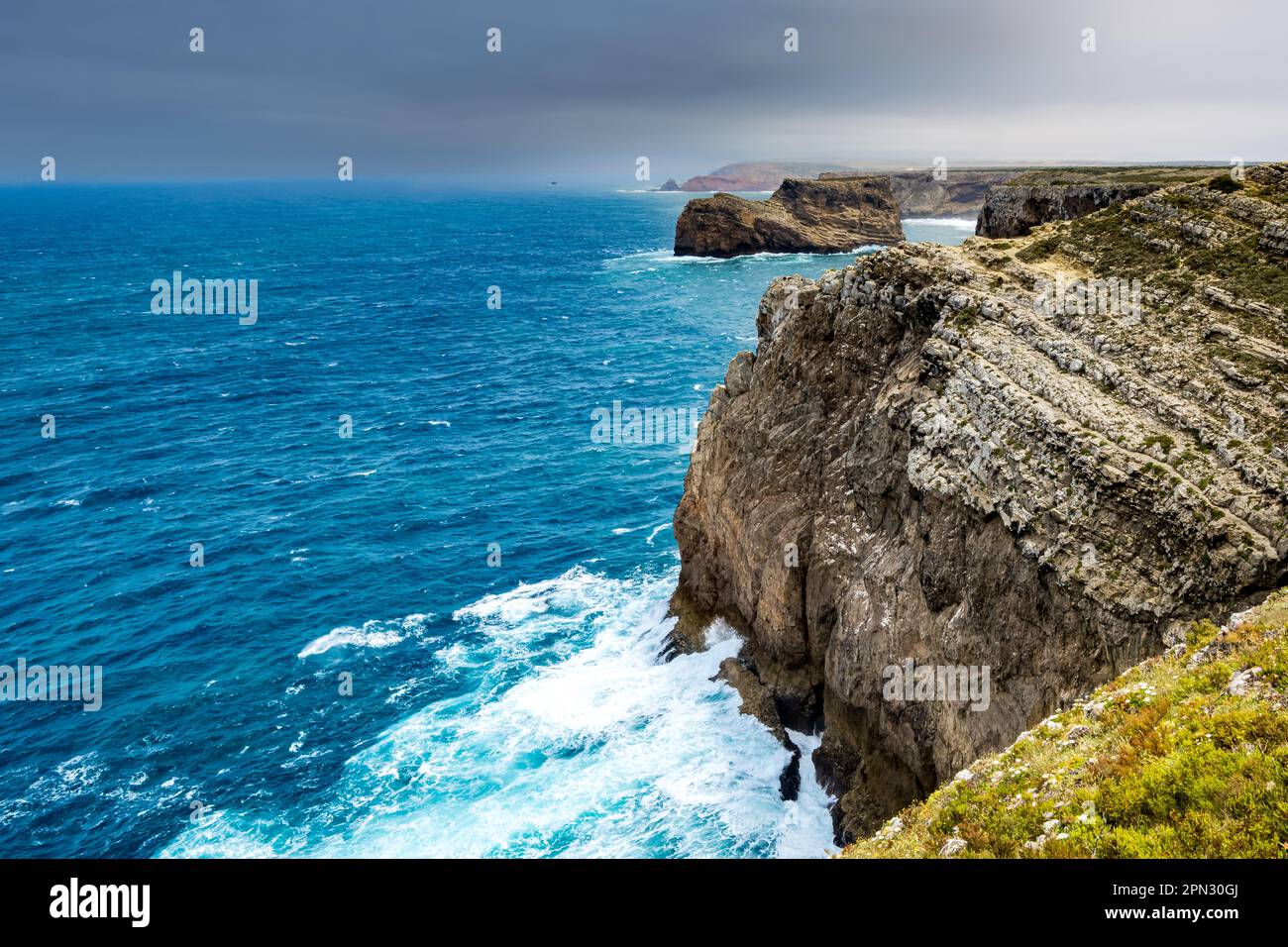 The southwesternmost point of Europe with its rugged landscape, where waves fiercely crash against Cape Saint Vincent cliffs. Stock Photo